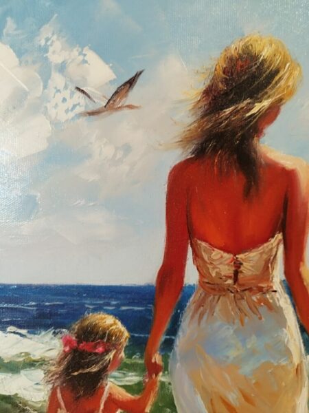 Back view of a woman in a white dress holding a child's hand at the beach, seaward horizon with a bird in the sky.